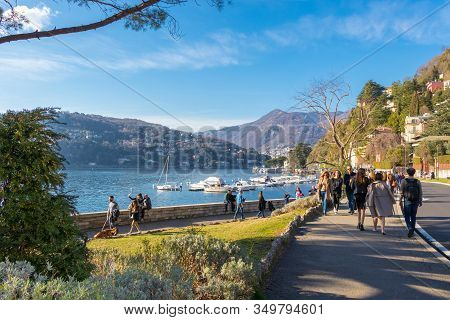 Lake Como, Tourist And Locals People Walking At Lakefront Viale Geno In Lake Como, Italy - March 10,