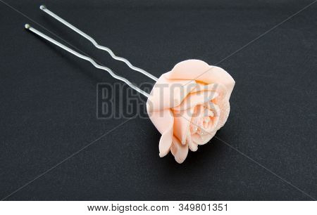 Hairpin With A Pink Rose On A Black Background Close-up. Beautiful Female Hairpin With A Flower.