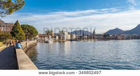 Lake Como, Tourists And Local People Walking At Lakefront Viale Geno In Lake Como, Italy - March 10,