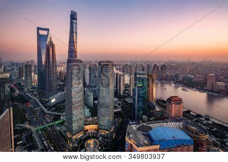 night view of illuminated Lujiazui skyline and Ring Road Circular Footbridge, Shanghai, China