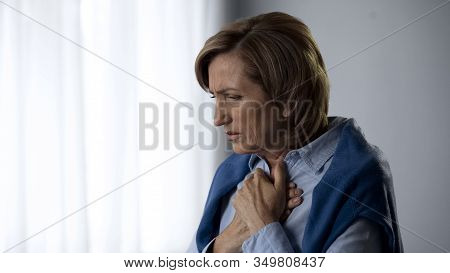 Extremely Worried Aging Female Suffering Chest Pain, Emotional Experience