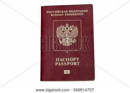 Red Biometric Passport Of A Russian Citizen Isolated On White Background, Close-up. Inscription - Ru