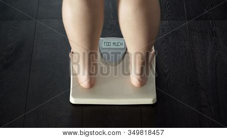 Word Too Much Written On Scales Screen, Woman Warned About Excessive Weight