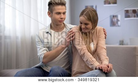 Boy Trying To Hug Shy Girl, Looking At Her With Love, Inexperience In Relations