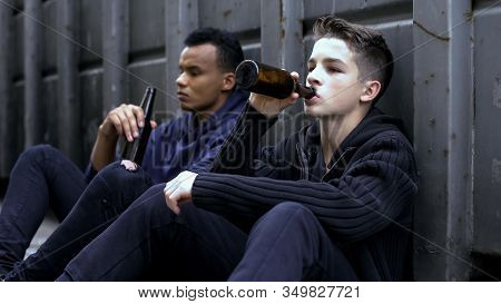 Teenager Guys Drinking Beer Sitting On Road, Bad Company Influence, Experience