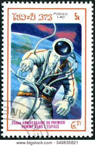 Laos - Circa 1986: A Stamp Printed In Laos, Dedicated To The 25th Anniversary Of First Man In Space,