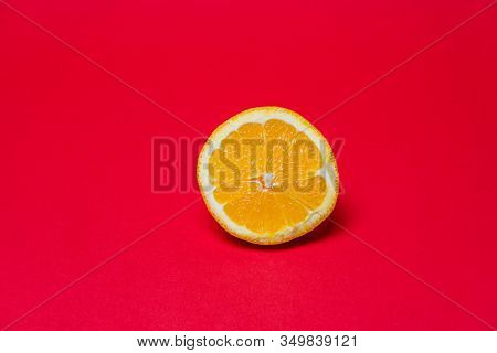 Ripe Fresh Orange On A Redbackground. Clipping Path
