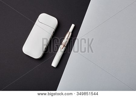 Electronic Cigarette Technology. Tobacco Iqos System. Close-up An Electric Hybrid Cigarette With A H