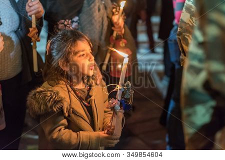 Heraklion, Crete, Greece - 28 April 2019: People Celebration With Lit Candles Easter Night Outside A