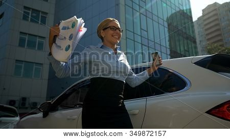 Businesslady Happy With Investment Reads Message Of Successful Tranche On Phone
