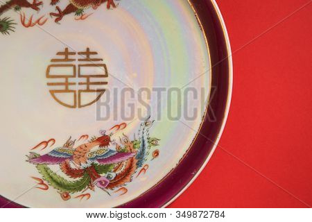 dragon and phoenix Teapot and cups used in traditional Chinese wedding ceremony with chinese sign meaning happinese. Translation: Double Happiness