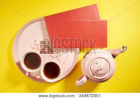 Teapot and cups used in traditional Chinese wedding ceremony with chinese sign meaning happinese. Translation: Double Happiness