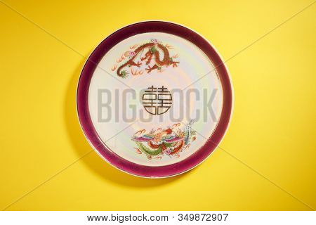 Teapot and cups used in traditional Chinese wedding ceremony with chinese sign meaning happinese. Translation: Double Happiness