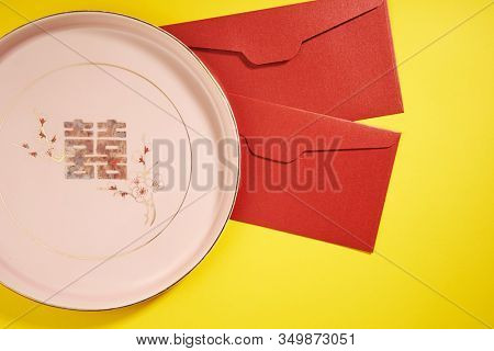 Teapot and cups used in traditional Chinese wedding ceremony with chinese sign meaning happinese. Translation: Double Happiness