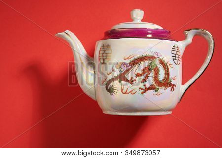dragon and phoenix Teapot and cups used in traditional Chinese wedding ceremony with chinese sign meaning happinese. Translation: Double Happiness