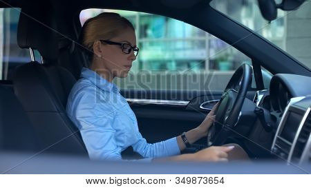 Confident Woman Shifting Gear Trying To Run Car, Test-drive Of Luxury Vehicle