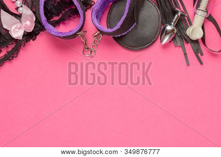 Bdsm Kit From Sex Shop. Leather Whip, Buttplug, Vibrator, Handcuffs, Female Panties And Other On Pin