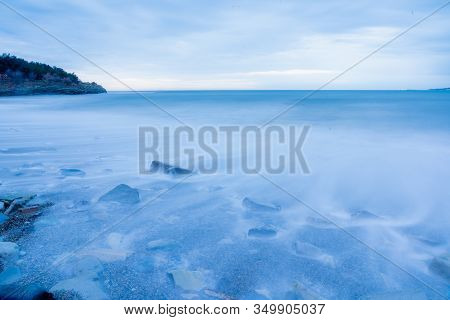 Storm Surges At Slow Shutter Speeds On A Pebble-sandy Beach, The Resort Of Gelendzhik, The Twilight.