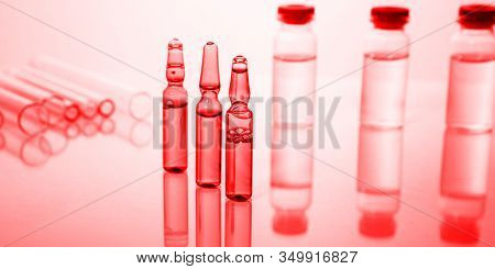 Group Of Vials With Medication On Blue Methacrylate Table. Horizontal Composition.