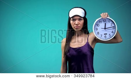 Angry Woman Showing Clock, Unable To Sleep Late At Night, Insomnia Problem