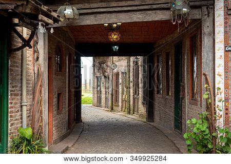 Gonzalez Catan, Argentina, September 28, 2019: Cobblestone Path Through Abandoned Building In The Am