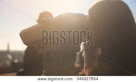 Woman Tourist Enjoying Aerial City Panorama Looking To Tower Viewer On Skydeck