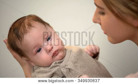 Beautiful Lady Holding Little Adorable Child In Arms, Skin-to-skin Contact