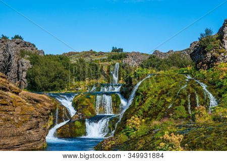 Waterfall In Gjain In Thjorsardalur Valley In South Iceland On A Sunny Summer Day