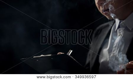 Concentrated Business Lady Smoking Cigarette And Filling Documents, Hard Work