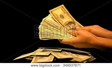 Hands Holding Bundle Of Dollars, Money Laundering, Illegal Business, Kickback