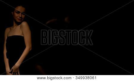 Beautiful Woman In Black Dress Looking At Camera, Place For Text, Seduction