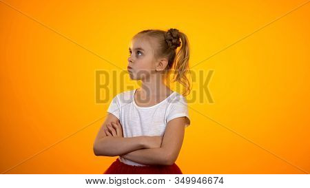 Preteen Girl With Hands Crossed Frowning And Turning Away, Enfant Terrible