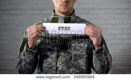 Ptsd Written On Sign In Hands Of Male Soldier, Posttraumatic Disorder, Health