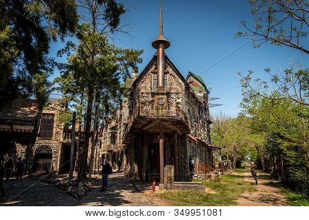 Gonzalez Catan, Argentina, September 28, 2019: People Walking Along Cobblestone Path Through Abandon