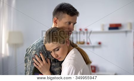Sad Wife Hugging Military Officer, Goodbying Before Duty, Support And Care, Love