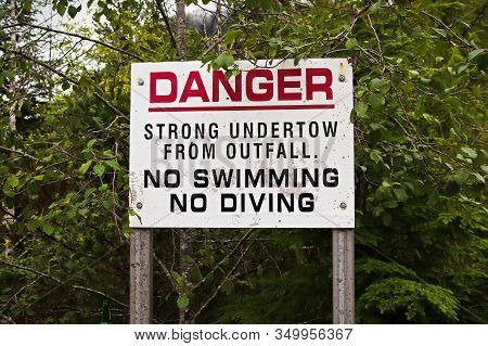 A Danger Strong Undertow, No Swimming Or Diving Sign