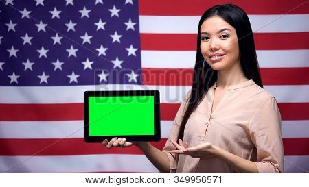 Girl Holding Tablet With Green Screen, Usa Flag On Background, Migration