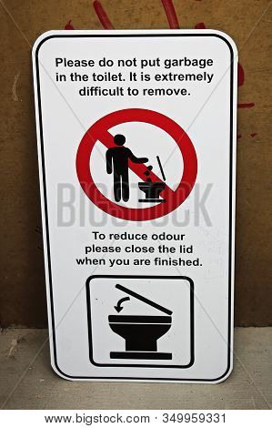 A Please Do Not Put Garbage In Toliet Sign