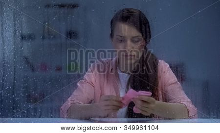 Sad Wounded Face Lady Holding Pink Socks On Rainy Day, Misbirth After Violence