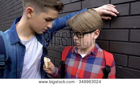 Teen Student Extorting Pocket Money From Classmate, School Bullying, Closeup