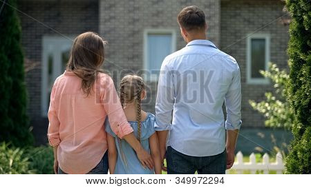 Family Of Tree Looking At House, Goodbying With Old Home, Moving Concept