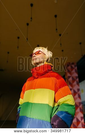 blond lesbian woman with red singlasses 