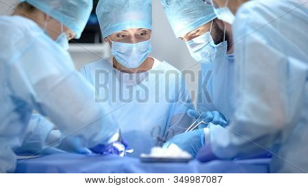 Serious Surgeon Team Performing Cardiothoracic Surgery, Hospital Operation
