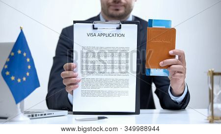 Eu Consular Officer Showing Visa Application And Passport, Refugee Policy