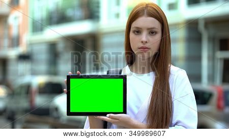 Serious Girl Holding Green Screen Tablet, Online Courses, Free Trial Lesson