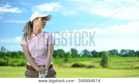 Inexperienced Woman Playing Golf, Unsuccessful Attempt To Hit Ball, Loser