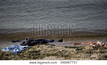 Scattered Clothes Washed Up In Sea Water, Shipwreck Death Statistics, Tsunami