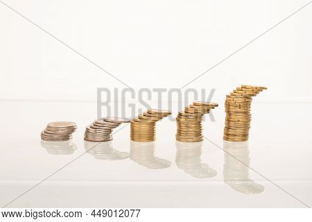 Stack Of Coins On A Desks. A Lof Of Copy Space. Investment. Economy. Finance. Savings.