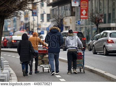 Bucharest, Romania - January 13, 2022: A Few Dealers From An Used Bookstore Carry Two Supermarket Ba
