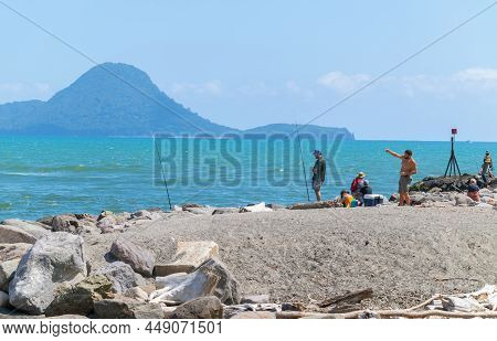 Whakatane New Zealand - January 30 2022; Fishers Trying Their Luck On Rock Groyne At Whakatane Heads